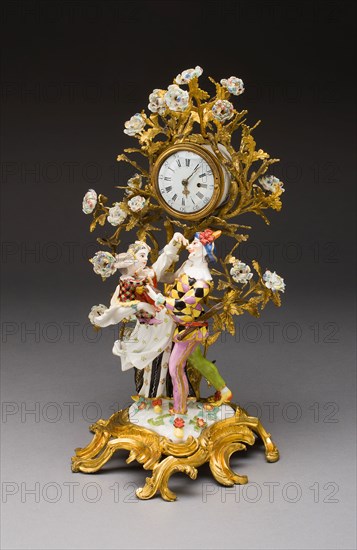 Harlequin Family Clock, c. 1740, Meissen Porcelain Manufactory, German, founded 1710, Model by: Kändler, Johann J., German, 1706-1775, Meissen, Hard-paste porcelain, polychrome enamels, and gilding, Figures: 17.8 x 11.4 cm (7 x 4 1/2 in.), Overall: 34.3 x 18.4 x 17.8 cm (13 1/2 x 7 1/4 x 7 in.), Buddha with Hand in Gesture of Teaching (Vitarkamudra), Dvaravati period, 8th century, Thailand, Thailand, Bronze, 52.0 × 15.1 × 12.4 cm (20 1/4 × 4 7/8 in.)