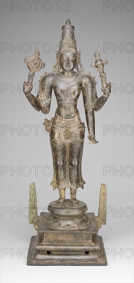 Four-Armed God Vishnu Holding Discus and Conch, Vijayanagar period, 15th century, India, Tamil Nadu, Thanjavur, Thanjavur, Bronze, 85.9 × 31.2 × 28.2 cm (33 7/8 × 12 9/16 × 11 1/8 in.)