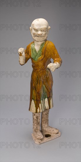 Groom, Tang dynasty (618–907 A.D.), first half of 8th century, China, Earthenware with three-color (sancai) lead glazes and traces of pigments, 59.5 × 18.8 × 20.5 cm (23 7/16 × 7 3/8 × 8 1/16 in.)