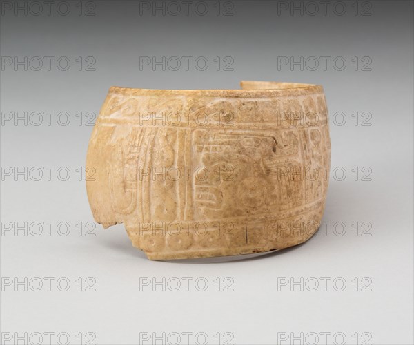 Shell, Possibly an Arm Band, Incised with Profile Head Framed by Geometric Motifs (Frament), c. A.D. 1200, Possibly Mixtec, Oaxaca or Guerero, Mexico, Guerrero state, Shell, 6.7 x 8.9 cm (2 5/8 x 3 1/2 in.)
