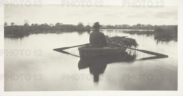 Rowing Home the Schoof-Stuff, 1886, Peter Henry Emerson, English, born Cuba, 1856–1936, England, Platinum print, pl. XXI from the album "Life and Landscape on the Norfolk Broads" (1886), edition of 200, 13.8 × 27.8 cm (image/paper), 28.6 × 40.8 cm (album page)