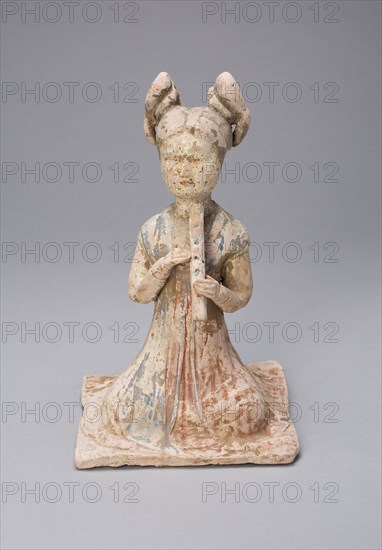 Female Musician, Tang dynasty (A.D. 618–907), late 7th/early 8th century, China, Earthenware with polychrome pigments, 20.7 × 13.4 × 12.9 cm (8 1/8 × 5 1/4 × 5 1/16 in.)