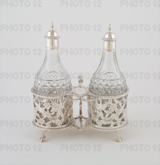 Cruet Set, c. 1760, Thomas Williamson, Irish, active 1750-70, Dublin, Ireland, Dublin, Silver and glass, Stand: 8.6 × 16.7 × 11 cm (3 3/8 × 6 9/16 × 4 5/8 in.), Bottles (with caps): 17.5 × 6 cm (6 7/8 × 2 3/8 in.)