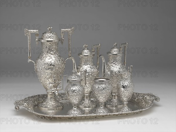 Tea and Coffee Service with Tray, 1850/1900, Andrew Ellicott Warner, American, 1786–1870, Andrew Ellicott Warner Jr., American, 1813–1896, Schofield Co. Inc., American, active 1903–65, Baltimore, Baltimore, Silver, Tray: 77.5 × 46.7 cm (31 ½ × 18 3/8 in.), urn, h.: 44.1 cm (17 3/8 in.), 1988.5 g, pot, h.: 34 cm (13 3/8 in.), 1093.6 g, pot, h.: 33.3 cm (13 1/8 in.), 1066.5 g, sugar bowl, h.: 22.5 cm (8 7/8 in.), 647.5 g, creamer, h.: 23.3 cm (9 3/16 in.), 363.4 g, slop basin, h.: 17.8 cm (7 in.), 408.9 g