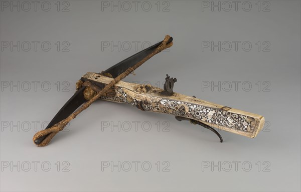 Sporting Crossbow, 1600/30, German, Germany, Wood, steel, ebony, ivory, mother-of-pearl, brass, cord, and fiber weave, 11.4 x 63.5 x 63.5 cm (4 1/2 x 25 x 25 in.)