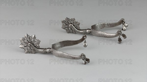 Pair of Rowel Spurs, early 17th century, North European, Northern Europe, Iron and silver, L. 16.5 cm (6 1/2 in.), W. 8.9 cm (3 1/2 in.)