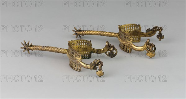 Pair of Rowel Spurs, c. 1500/25, German, Germany, East, Brass or bronze with gilding, L. 19.7 cm (7 3/4 in.), W. 7.8 cm (3 in.)
