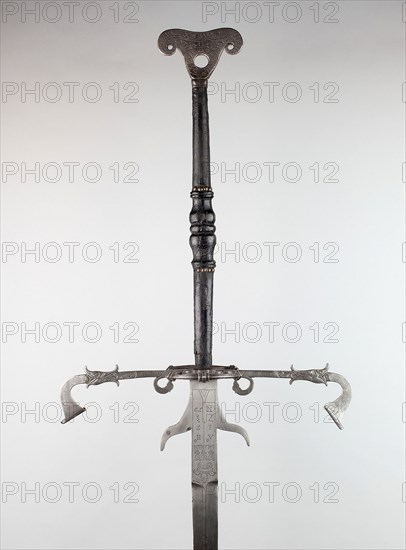 Two-Handed Sword for the Bodyguard of Julius, Duke of Brunswick-Lüneburg and Prince of Wolfenbüttel, 1573, Northern German, Brunswick, Northern Germany, Iron, steel, brass, wood, and leather, Overall L. 198.1 cm (6 ft. 6 in.)