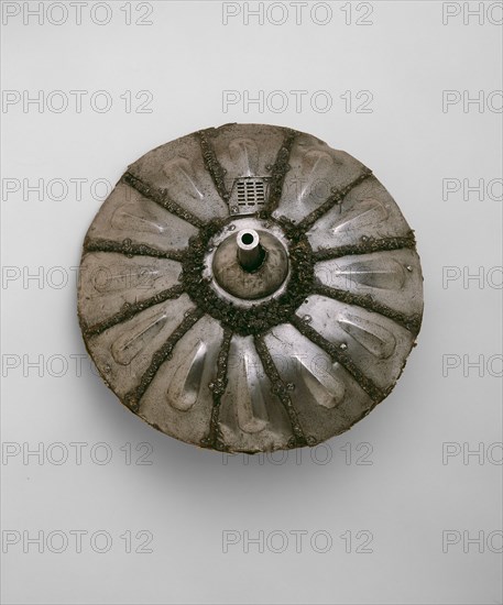 Gun Shield, c. 1544, Italian, Italy, Steel, iron, wood, wool textile, and hemp fiber, Diameter 44.5 cm (17 1/2 in.)