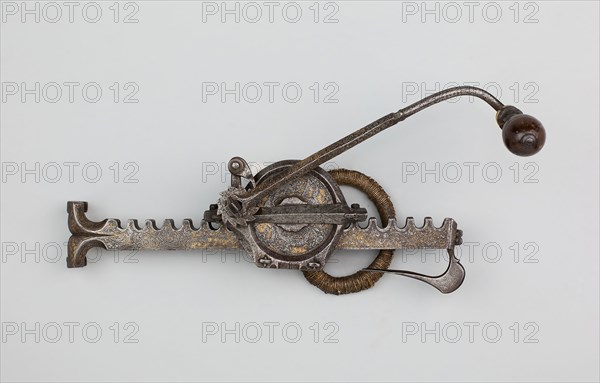 Cranequin (Winder) for a Sporting Crossbow, 1550/1600, German, Mark: Star surmounted by the letters H W, Germany, Steel with gilding, wood, horn, and cord, L. (overall) 33.9 cm (13 3/8 in.)