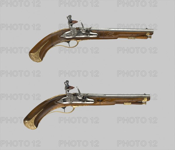 Pair of Flintlock Pistols, early 18th century, Barrels signed Lazzarino Cominazzo, Italian, Brescia, act. 1685—1729, Locks  signed Giovanni Botti, Italian, Brescia, act. 1685—1729, Brescia, Walnut and gilt brass, L. 35.6 cm (14 in.)