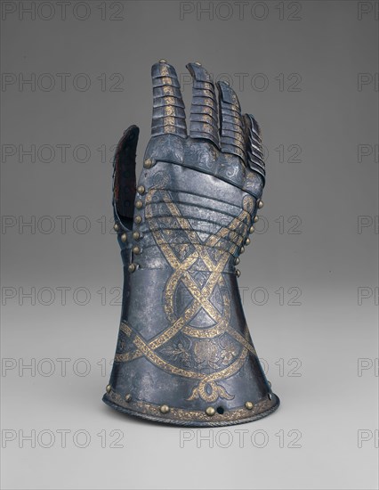Gauntlet from a Tournament Garniture of a Hapsburg Prince, 1571, Attributed to Anton Peffenhauser, (German 1525—1603) Augsburg, Augsburg, Steel, gilding, brass, and leather, 13.3 × 13.3 × 28 cm (5 1/4 × 5 1/4 × 11 in.)