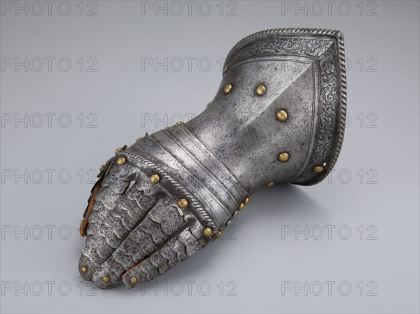 Fingered Gauntlet for the Left Hand, c. 1560, Northern Italian, Northern Italy, Steel, leather, and brass, L. 29.9 cm (11 3/4 in.)