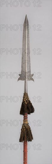 Partisan, early 17th century, Italian, perhaps Netherlandish, Italy, Steel, wood, cloth, brass, and cotton tassels, Blade with socket L. 71.1 cm (28 in.)
