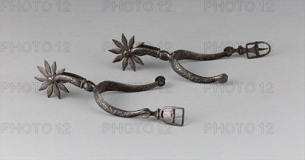 Pair of Spurs, early 17th century, North European, Europe, Iron and silver, L. 16.5 cm (6 1/2 in.), W. 8.9 cm (3 1/2 in.)