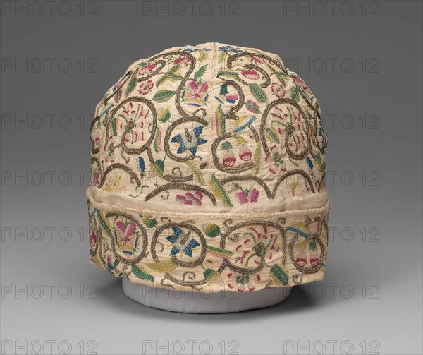 Man’s Cap, 1601/25, England, Linen, plain weave, embroidered with silk floss and gilt-metal-strip-wrapped silk, in variety of buttonhole, chain, long-armed cross, ladder, outline, and running stitches, woven wheels, 15.9 × 19.6 × 19.6 cm (6 3/8 × 7 3/4 × 7 3/4 in.)