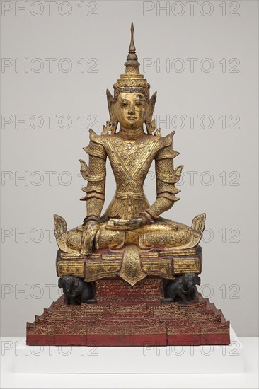 Crowned and Bejewelled Buddha Seated on an Elephant Throne, Late 19th century, Burma (now Myanmar), Burma, Gilded and lacquered wood with paint and colored glass, 144.5 × 85.2 × 49.2 cm (56 7/8 × 33 9/16 × 19 3/8 in.)