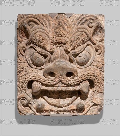 Architectural Brick with Ogre Mask, Tang dynasty (A.D. 618–907), probably second half of 8th century, China, from the pagoda at Xiuding Si (Xiuding Temple) at Mount Qingliang, near Anyang, Henan province, China, Molded terracotta with traces of slip pigment, 42.0 × 36.2 × 11.4 cm (16 1/2 × 14 1/4 × 4 1/2 in.)