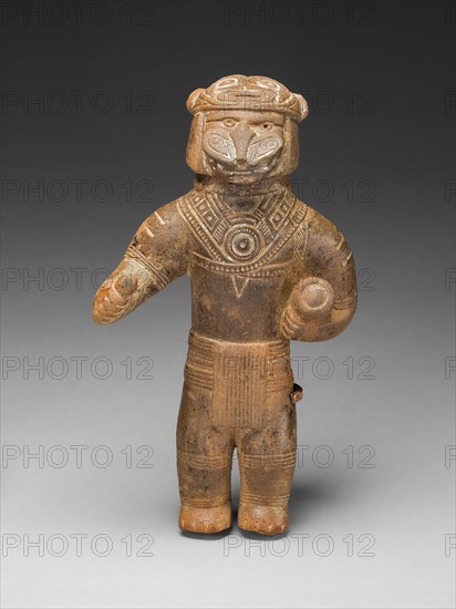 Masked Figurine Holding a Drum, Possibly a Ocarina (Whistle), c. A.D. 1300, Tairona, Sierra Nevada de Santa Marta, Colombia, Colombia, Ceramic and pigment, H. 12.7 cm (5 in.)