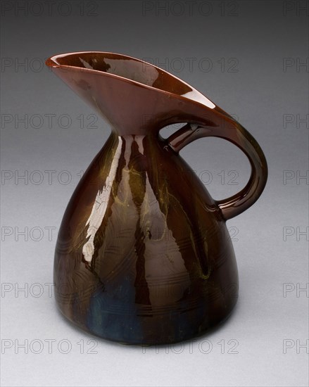 Pitcher, 1880, Designed by Christopher Dresser, English, born Scotland, 1834-1904, Manufactured by Linthorpe Art Pottery, English, Yorkshire, 1879-1889, Yorkshire, Lead-glazed earthenware, 19.4 x 15.9 x 14 cm (7 5/8 x 6 1/4 x 5 1/2 in.)