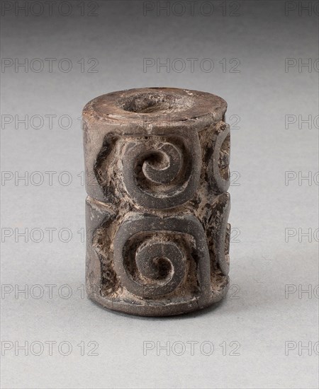 Roller Seal, 800/400 B.C., Olmec, Veracruz or Tabasco, Gulf Coast, Mexico, México, Ceramic and pigment, 7.6 x 5.4 cm (3 x 2 1/8 in.), Standing Figurine with Missing Leg, 800/400 B.C., Olmec, Guerrero, Mexico, Guerrero state, Jade, H. 9.2 cm (3 5/8 in.)