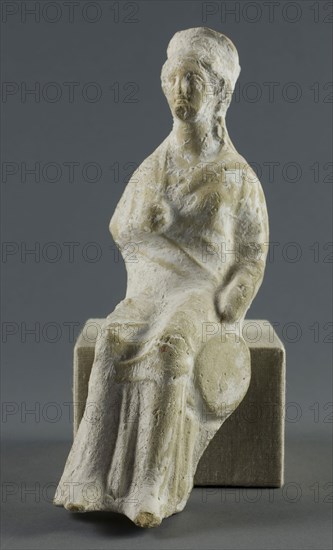 Statuette of a Seated Woman, 400/350 BC, Greek, Greece, terracotta, 18.1 × 6.4 × 7.6 cm (7 1/8 × 2 1/2 × 3 in.)