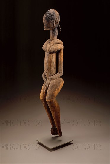 Male Figure, Possibly 18th century, Dogon, Bandiagara region, Mali, Northern Africa and the Sahel, Mali, Wood and sacrificial material, 98.5 x 15.5 x 13.9 cm (39 1/4 x 6 1/8 x 5 1/2 in.)