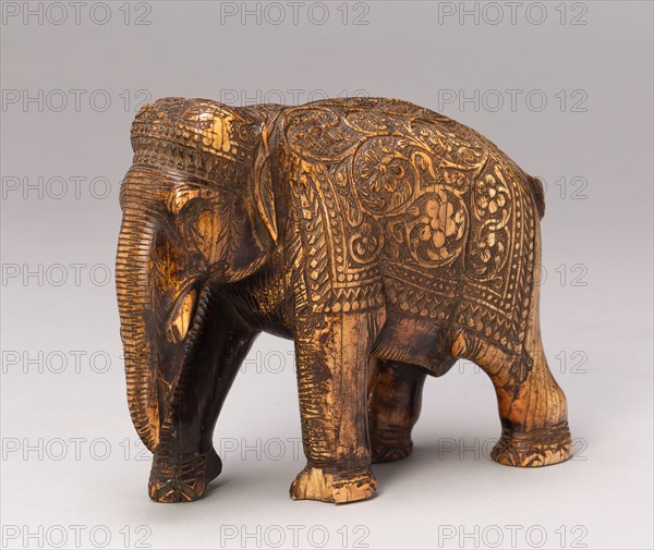 Walking Elephant with Floral Caparison, 17th century, India, Deccan, Deccan, Ivory, 10.3 × 14 × 5.8 cm (4 × 5 1/2 × 2 1/4 in.)