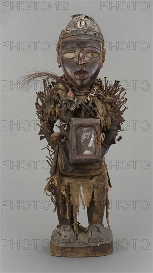 Male Figure (Nkisi Nkondi), Early/mid–19th century, Vili, Republic of the Congo, Central Africa, Wood, metal, glass, fabric, fiber, cowrie shells, bone, leather, gourd, and feathers, H. 72 cm (28 1/3 in.)