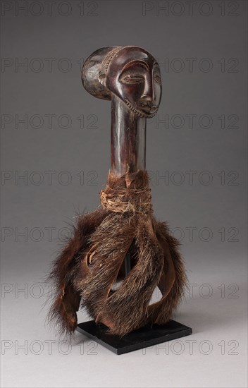 Ritual Head, Mid–/late 19th century, Hemba, Democratic Republic of the Congo, Central Africa, Democratic Republic of the Congo, Wood, animal fur (contemporary facsimile based on period examples), and twine, 33 × 17.8 × 14 cm (13 × 7 × 5 1/2 in.)