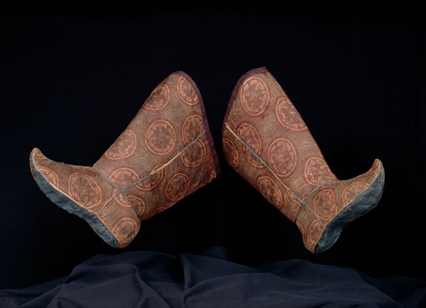 Pair of Woman’s Boots with Tying Ribbon, Tang dynasty(618–906)/ Song dynasty(960–1279), 10th/11th century, China, Outer boot: silk, complementary weft twill weave with inner warps, seam trim cord: silk, oblique interlacing, ribbon and top boot edge binding: silk, simple and complex gauze weave, lined with silk, plain weave, lining’s upper edge facing: silk, twill damask weave, sole: silk, plain weave, tying ribbon: twill weave self-patterned by areas of twill weave, a: 40 × 29.2 cm (15 3/4 × 11 1/2 in.)