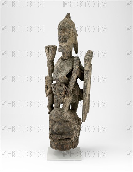 Headdress (Jagún Jagún), Mid–/late 19th century, Yoruba, Ekiti region, Nigeria, Coastal West Africa, Nigeria, Wood, iron, nails, fiber, and sacrificial materials, H. 111.8 cm (44 in.)