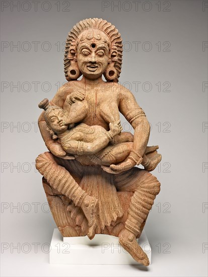 The Infant Krishna Killing the Ogress Putana, 17th century, India, Kerala, Kerala, Wood with traces of red and blue pigments, 73.2 x 35.4 x 24.1 cm (28 7/8 x 14 x 9 1/2 in.) (with base)