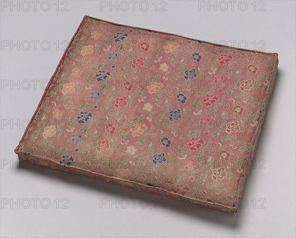 Cushion, Qing dynasty (1644– 1911), late 19th century, China, Silk, warp-float faced 5:1 satin weave with weft-float faced 1:2 'S' twill interlacings of secondary binding warps and supplementary patterning and self-patterning ground wefts, 4.9 × 49.2 × 40.8 cm (2 × 19 3/8 × 16 in.)