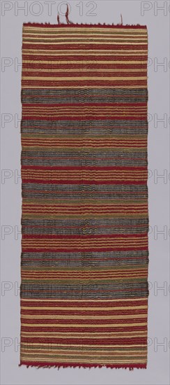 Cermonial Textile, 19th century, Indonesia, Bali, Buleleng, Bali, Cotton, bast fiber (probably ramie), and gold-leaf-on-paper-strip-wrapped bast fiber (probably ramie) bands of plain weave, weft resist dyed (weft ikat) plain weave and weft-faced plain weave, knotted main warp fringe, 124.5 × 43.4 cm (49 × 17 1/8 in.)
