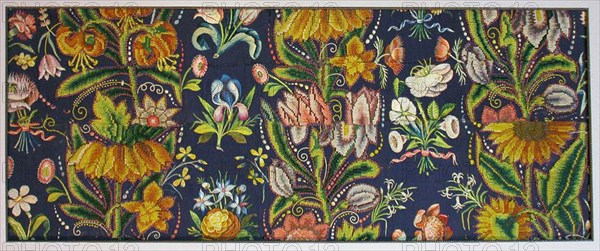 Panel, 1630/40, France, Wool, warp-float faced 2:1 ‘S’ twill weave, fulled, appliquéd with linen, plain weave, embroidered with wool and silk in cross stitches, embroidered with silk in satin, split, and stem stitches, laidwork, couching, and French knots, 36.4 × 91.8 cm (14 5/16 × 36 1/8 in.)