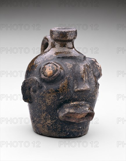 Face Jug, c. 1860, American, 19th century, Edgefield District, South Carolina, Edgefield county, Stoneware and alkaline glaze, H.: 13.3 cm (5 1/4 in.)