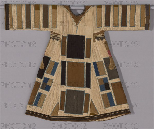Tunic (Jibbeh), 1885/99, Mahdiyya State, Sudan, Sudan, Layers of cotton, plain weave, pieced and quilted, appliquéd with wool and wool and cotton plain weaves and wool twill weaves, embroidered with cotton in chain, cross, and a derivative of herringbone stitches, applied plied yarn edging, lined with cotton plain weaves, pieced, 93.7 x 116.8 cm (36 7/8 x 46 in.)