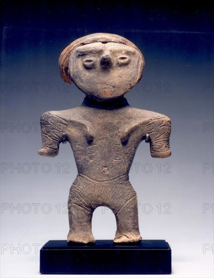 Female Figurine with Topknot, c. 1000–300 B.C., Japan, Earthenware, H. 14 cm (5.5 in.)