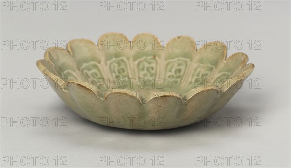 Scalloped Dish with Stylized Floral Sprays and Sickle-Leaf Scrolls, Northern Song (960–1127) or Jin dynasty (1115–1234), 12th/13th century, China, Yaozhou ware, glazed stoneware with underglaze molded scrolls, H. 2.7 cm (1 1/8 in.), diam. 9.6 cm (3 13/16 in.)