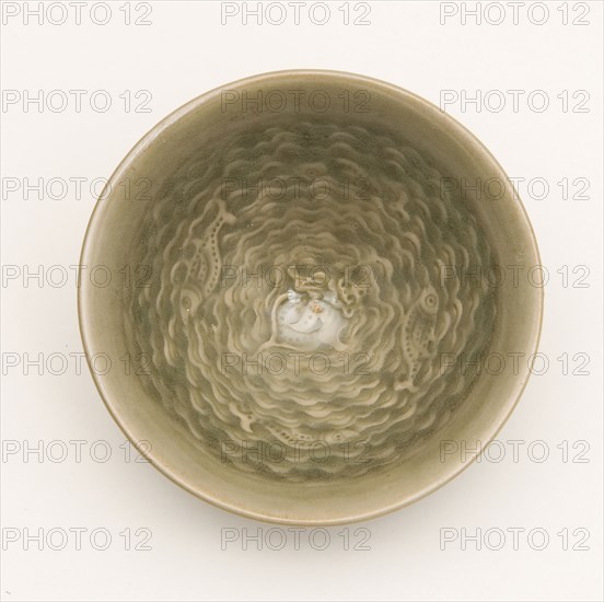Conical Bowl with Interior of Fish Swimming amid Waves Encircling a Sea Crab and Exterior of Stylized Petals, Jin dynasty (1115–1234), 12th century, China, Yaozhou ware, stoneware with underglaze molded and carved decoration, H. 4.1 cm (1 5/8 in.), diam. 9.6 cm (3 13/16 in.)