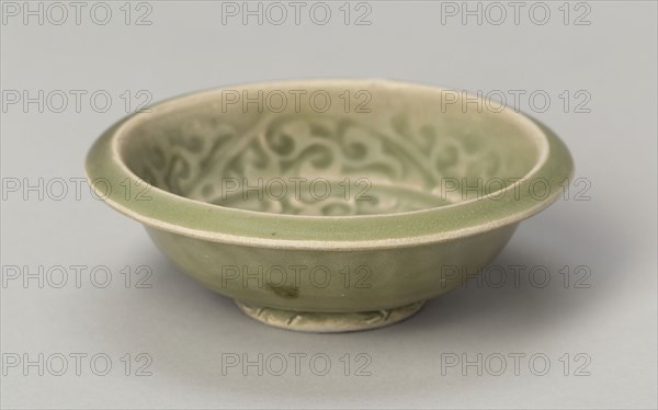 Basin with Stylized Flowers and Sickle-leaf Scrolls, Southern Song (1127–1279) or Yuan dynasty (1271–1368), c. 13th/14th century, China, Yaozhou ware, glazed stoneware with underglaze molded floral scroll, H. 3.1 cm (1 1/4 in.), diam. 8.7 cm (3 7/16 in.)