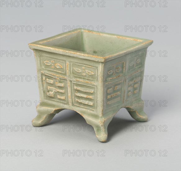 Square Jar with Archaistic Trigrams and Floral Scrolls, Yuan (1271–1368) or Ming dynasty (1368–1644), c. 14th/16th century, China, Longquan-type ware, stoneware with underglaze molded decoration, 6.6 × 7 × 7 cm ( 2 5/8 × 2 13/16 × 2 13/16 in.)