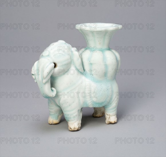 Joss-Stick Holder in the Form of an Elephant Holding a Lobed Vase, Yuan dynasty (1271–1368), China, Qingbai ware, glazed porcelain, 9.6 × 4.3 × 9.5 cm (3 3/4 × 1 11/16 × 3 3/4 in.)