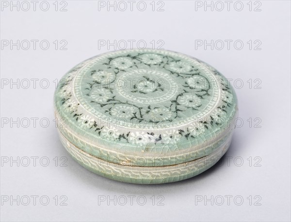 Covered Cosmetic Box with Chrysanthemum Flower Heads, Goryeo dynasty (918–1392), 13th century, Korean, South Asia, Stoneware with underglaze inlaid decoration of black and white clays, H. 3.7 cm (1 1/2 in.), diam. 10.3 cm (4 1/16 in.)