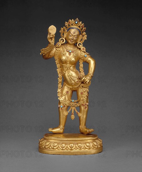 Tantric Enlightened Being (Vajrayogini) Queen of Bliss (Dechen Gyalmo), 18th century, Tibet, Tibet, Gilt bronze with gemstones and pigments, 22.4x 10.9 x 6.2 cm (8 13/16 x 4 1/4 x 2 7/16 in.)