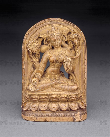 Goddess White Tara with Kneeling Donor at Base, c. 12th century, Tibet, Central Tibet, Central Tibet, Phyllite, 7.3 × 4.8 × 2.3 cm (2 7/8 × 1 7/8 × 7/8 in.)