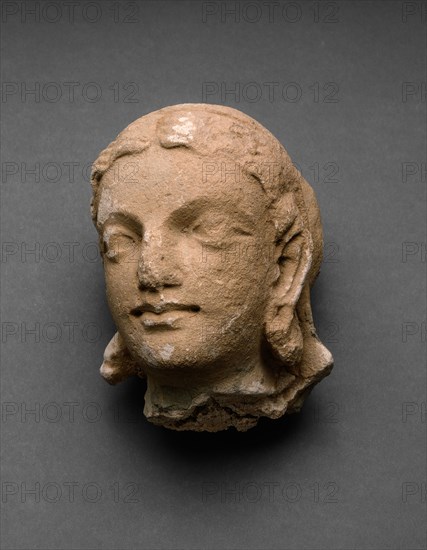 Head of a Female Adorant, 4th/5th century, Afghanistan or Pakistan, Ancient region of Gandhara, Gandhara, Stucco, 11.8 × 9.3 × 10.5 cm (4 5/8 × 3 5/8 × 4 1/8 in.)