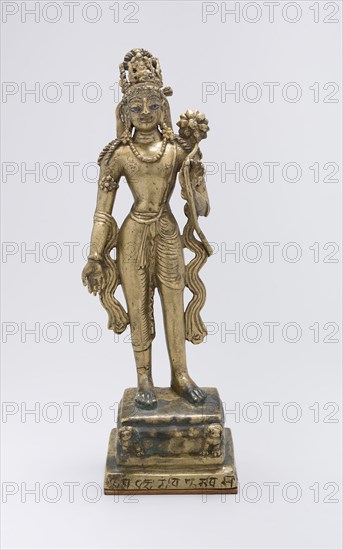 Standing Bodhisattva Avalokiteshvara Holding a Lotus Flower, early 9th century, Pakistan, Khyber Pakhtunkhwa Province, Swat Valley, Swat, Brass inlaid with copper and silver, 27.1 x 9.5 x 7.2 cm (10 5/8 x 3 3/4 x 2 13/16 in.)