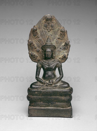 Buddha Enthroned on a Serpent (Naga), Angkor period, early 13th century, Cambodia/Thailand, Cambodia, Bronze, 22.9 × 10.5 × 7.7 cm (9 × 4 1/8 × 3 in.)